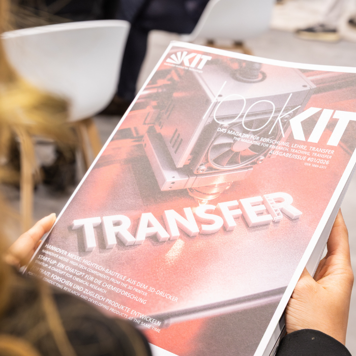 A woman holding the magazine in her hands